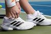 Adidas hits record revenue, launches buyback