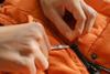 repairing-zipper-puffer-jacket_envato