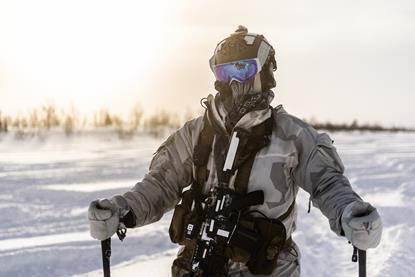A US Army special forces soldier moves out on skis in Swedish Artic during a eb. 2022 exercise