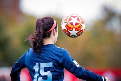 Girl plays football