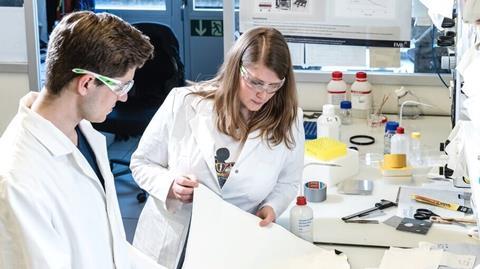 Anna Beltzung and Mario Stucki in a lab for Dimpora