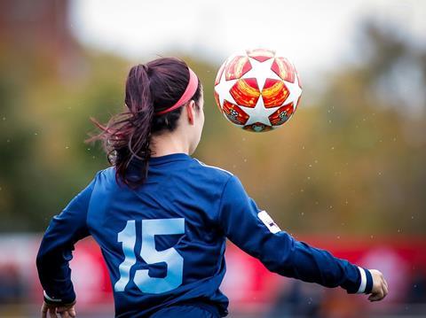 Girl plays football